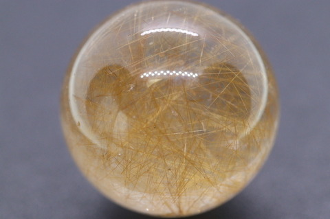 濃厚ルチル マニハール産 ゴールドルチル入り水晶丸玉22mm