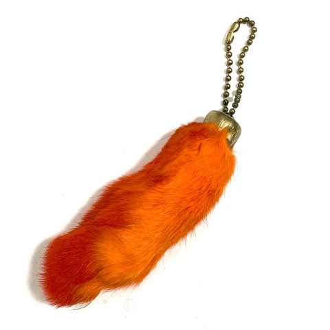 ~60s "ORANGE" DEAD STOCK LUCKY CHARM.