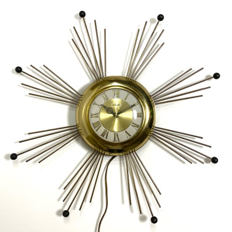 ~60s UNITED SUNBURST WALL CLOCK.